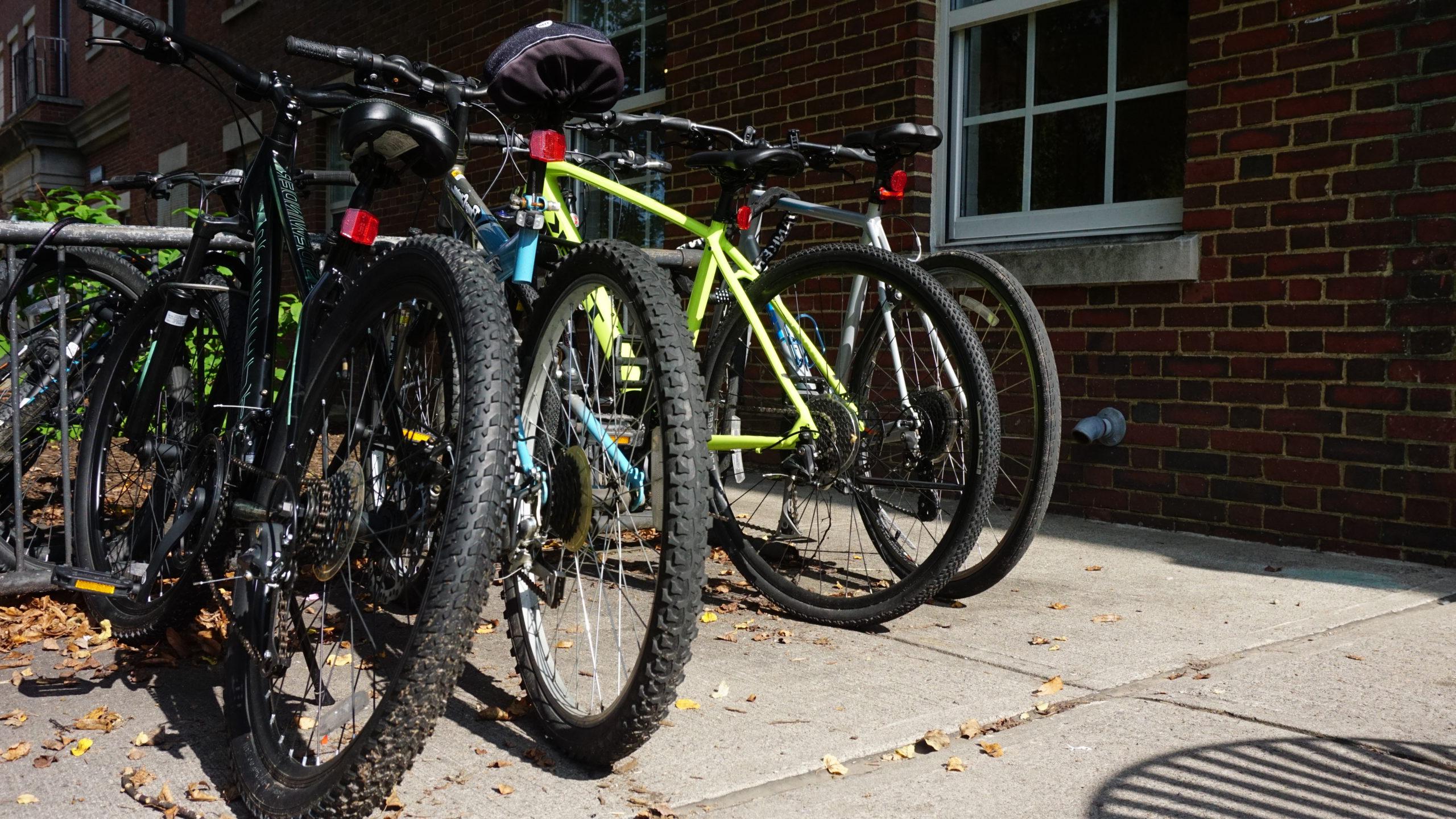 bikes parked at a bike rack on campus